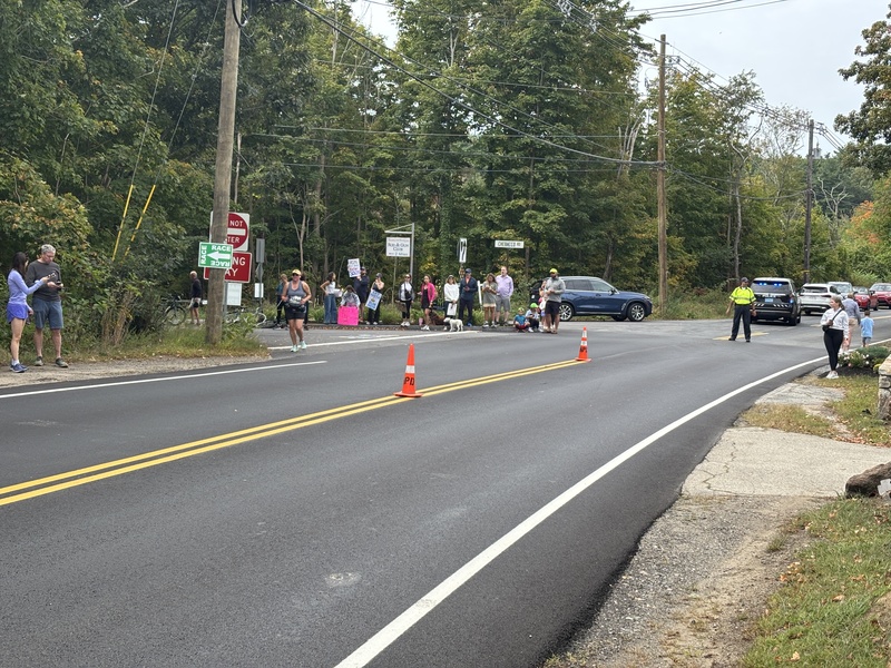 A photo of the Chebacco and Essex intersection with spectators and Joe the police officer