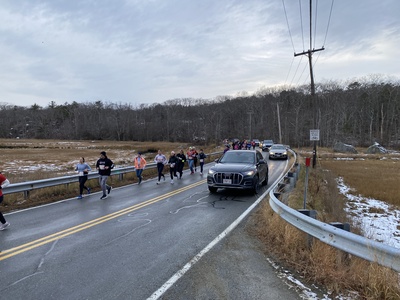 Picture of runners along Thatcher Rd