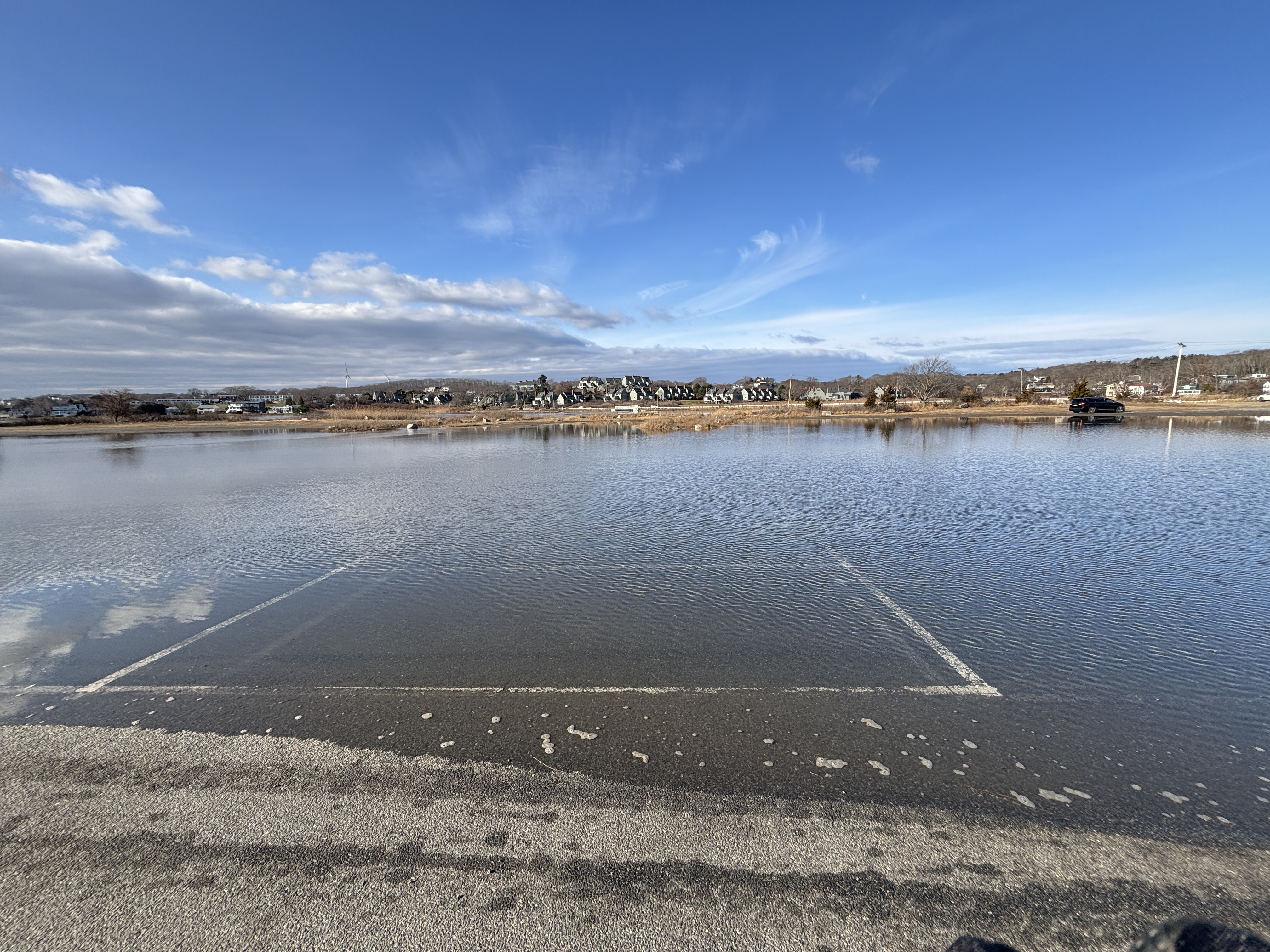 Photo of the parking lot flooded due to the high tide
